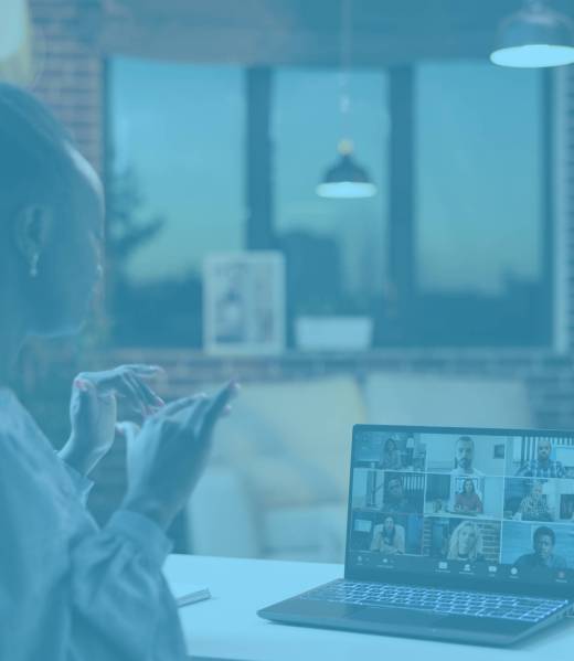 Corporate worker chatting with remote team on videocall using laptop, back view. Company colleagues discussing business on teleconference, freelancing and telework concept